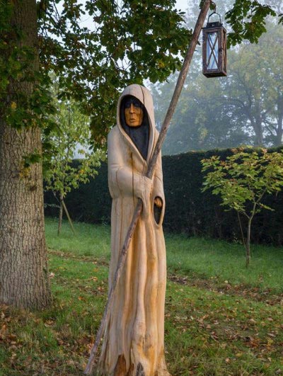 cloaked figure statue